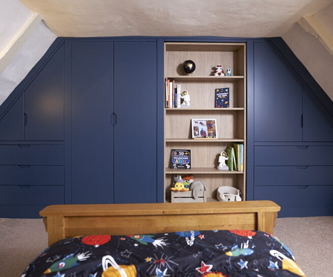 wide image of a wall of fitted bedroom cuboards